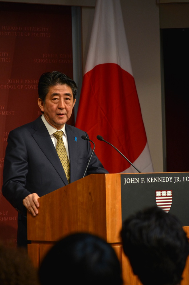 Japanese Prime Minister Shinzo Abe, standing in front of a Japanese flag, delivers an address in Japanese on Monday morning. Abe’s visit to the Institute of Politics was a part of the Prime Minister’s planned tour through the United States this week, which includes an address to be presented in front of Congress on Wednesday.