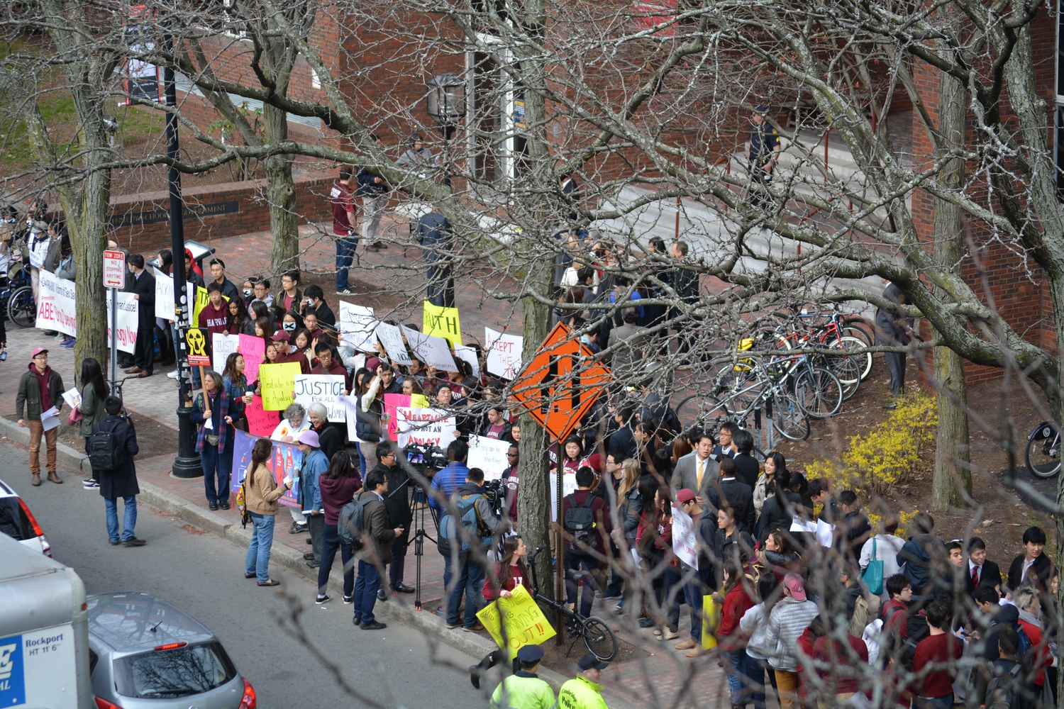 Harvard students hold up signs in protest of views expressed by Japanese Prime Minister Shinzo Abe on the treatment of “comfort women” during World War II. The protest, held outside of the Harvard Kennedy School, preceded an address by Abe at the Institute of Politics. 