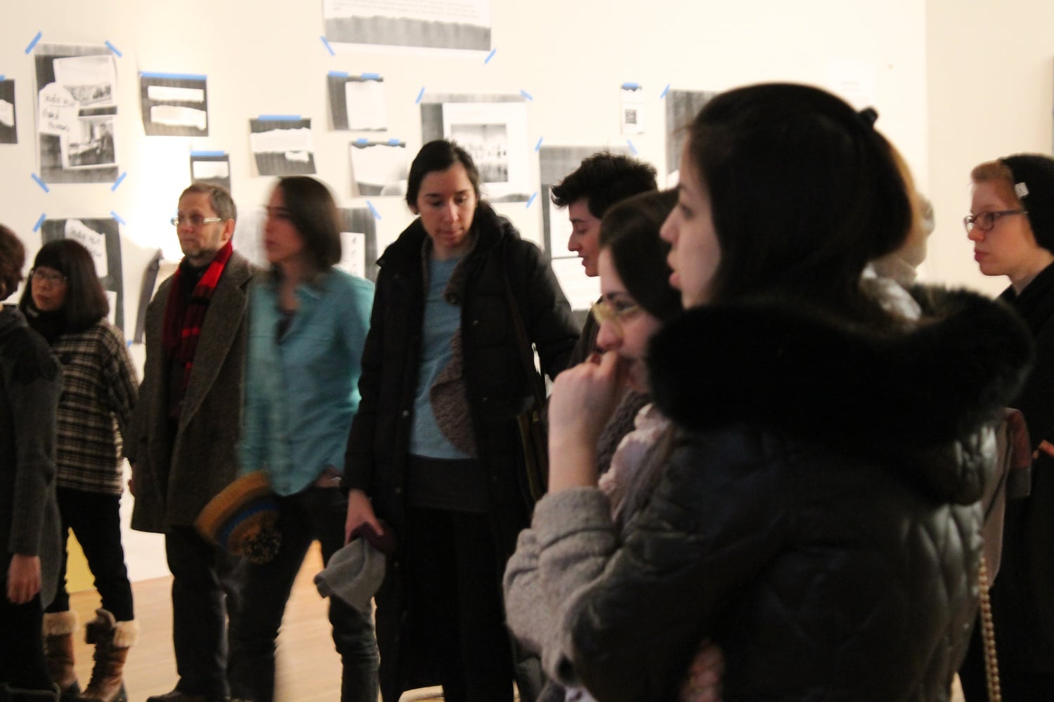 Visitors to the Arthur M. Sackler Museum view works from the exhibition opening of "here, without" on January 24.