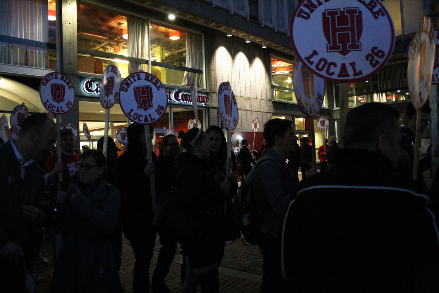 Harvard students and employees participate in a Local 26 protest on Tuesday evening in front of the Smith Campus Center. HUDS employee Fatima Leighton states, "I love working with the students, and I treat them with respect. My own daughter is in college and I hope she is being treated as I treat Harvard students." Local 26 represents hotel and food service workers in Boston.