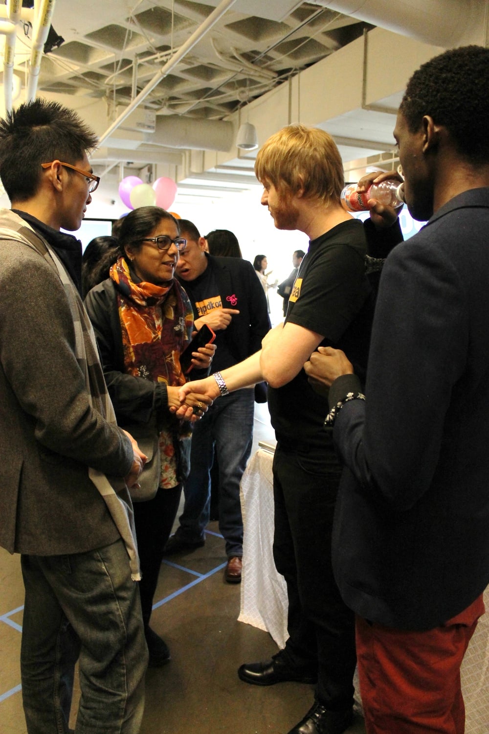 Students of the Graduate School of Education course Education Innovation and Social Entrepreneurship in Comparative Perspective speak to judges, faculty, and other visitors at the project presentation fair on Friday morning at the Harvard Innovation Lab. 