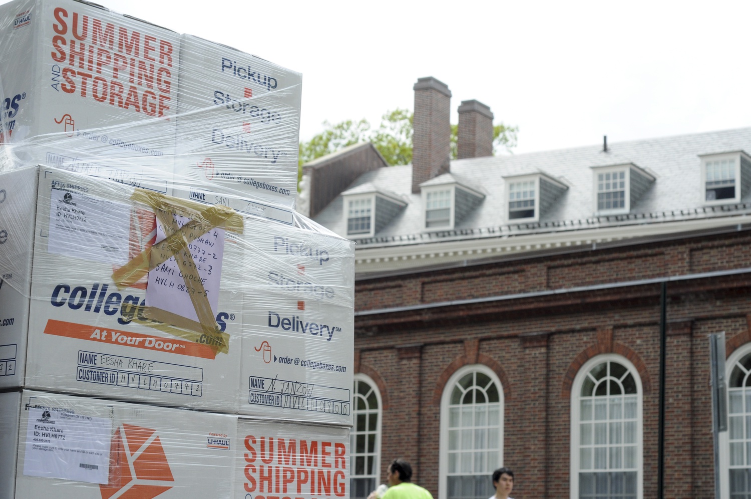 A wrapped pallet of students’ boxes waits outside Leverett House for storage on Tuesday afternoon. After the McKinlock Hall renovation, house storage was eliminated, thereby forcing students to find alternative means of storage for the summer.