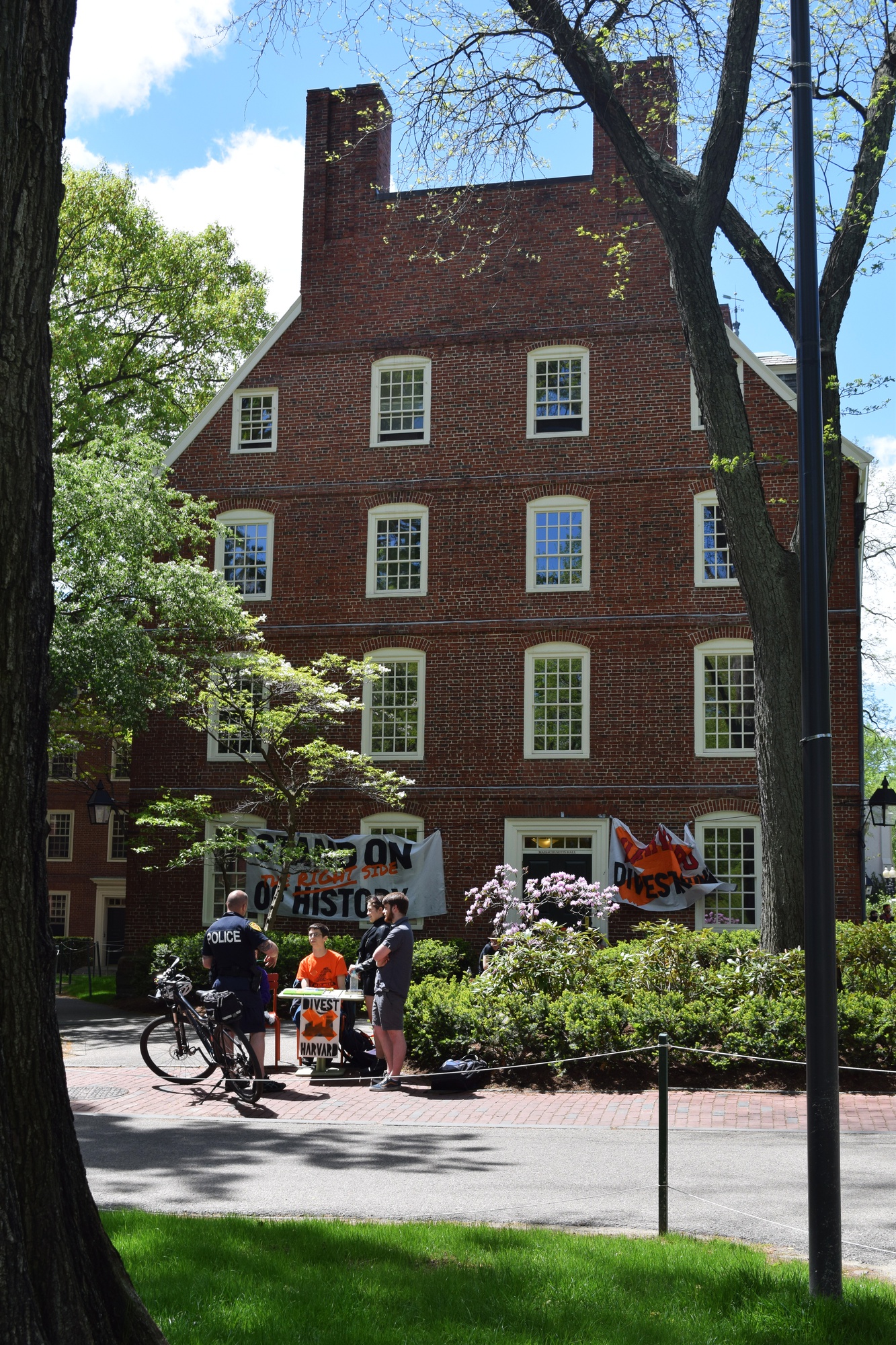 Members of the student activist group Divest Harvard blockade entrances to Massachusetts Hall on Wednesday to protest the recent appointment of Thomas J. Hollister, a former oil executive, as University chief financial officer.