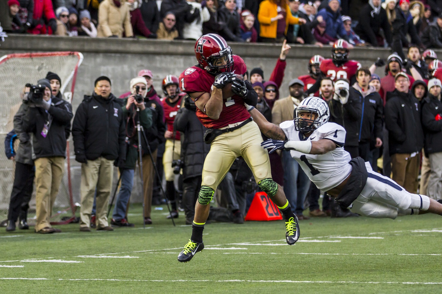 Andrew Fischer catches the game-winning score of the Harvard-Yale game on Nov. 22. The Crimson beat the Bulldogs, 31-24, in a thriller at Harvard Stadium that ensured sole possession of the Ivy title for Harvard.