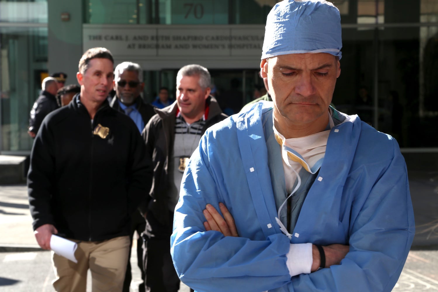 Members of the Boston Police Department and Brigham and Women’s Hospital personnel crossed the street away from the Harvard-affiliated hospital’s Shapiro building, where Harvard Medical School Assistant Professor Michael J. Davidson was fatally shot on Jan. 20.