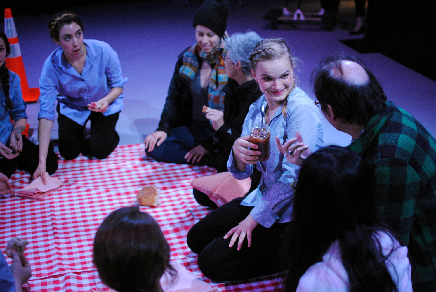 Liza Batkin ‘15 offered jam to an attendee during the opening of the Harvard Dance Project’s “LOOK UP” in November. At one stage of the installation, dancers invited attendees to sit and eat bread. 
