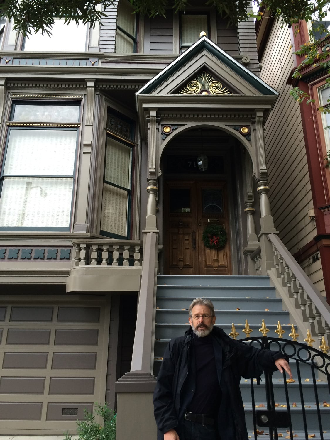 Former Crimson Managing Editor Hendrik Hertzberg ’65 poses in front of the house of Jerry Garcia of the Grateful Dead in San Francisco.