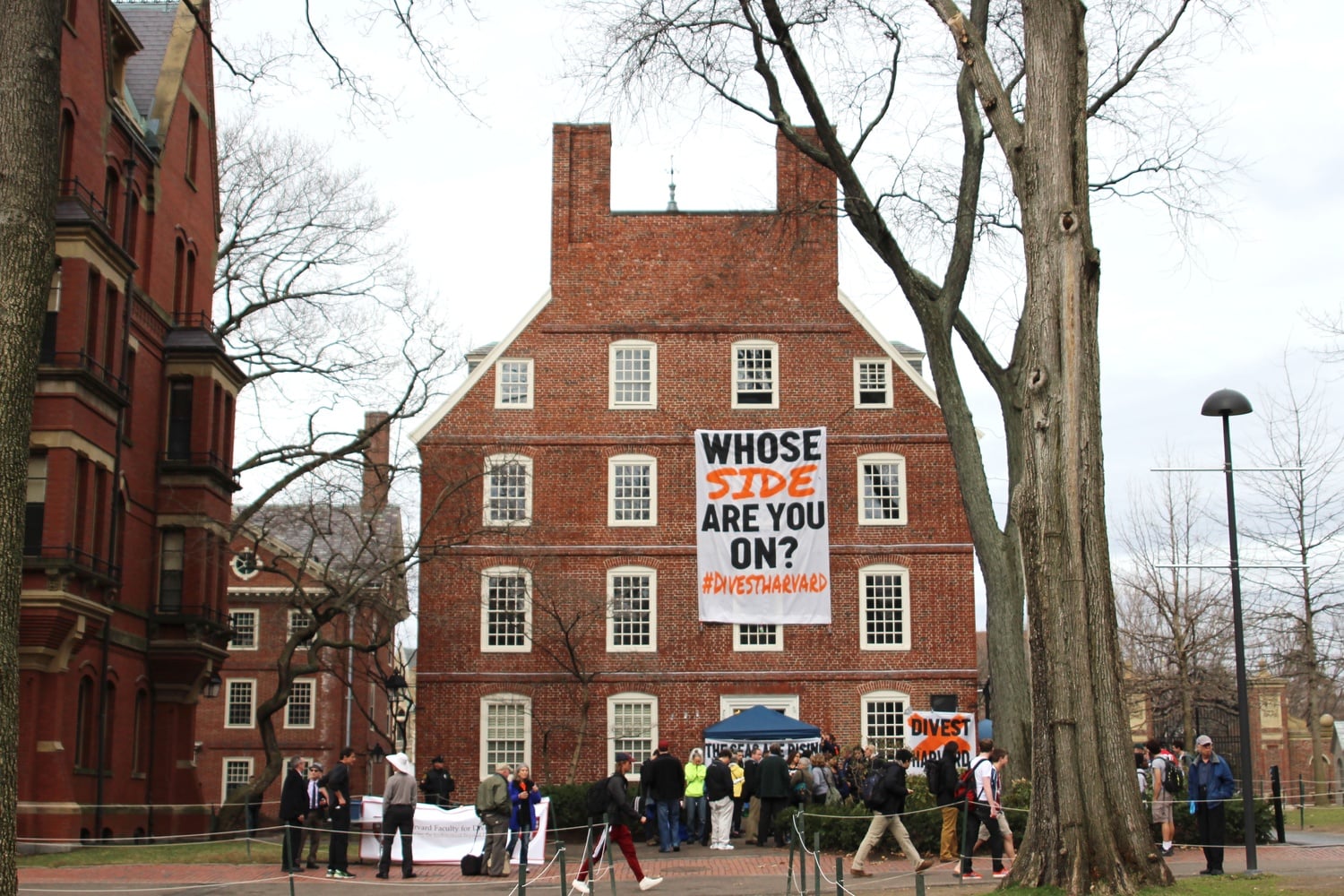 Protesters hang a banner from the upper floors of Massachusetts Hall on the second day of their weeklong April blockade of the administrative building, which houses University President Drew G. Faust’s office. 