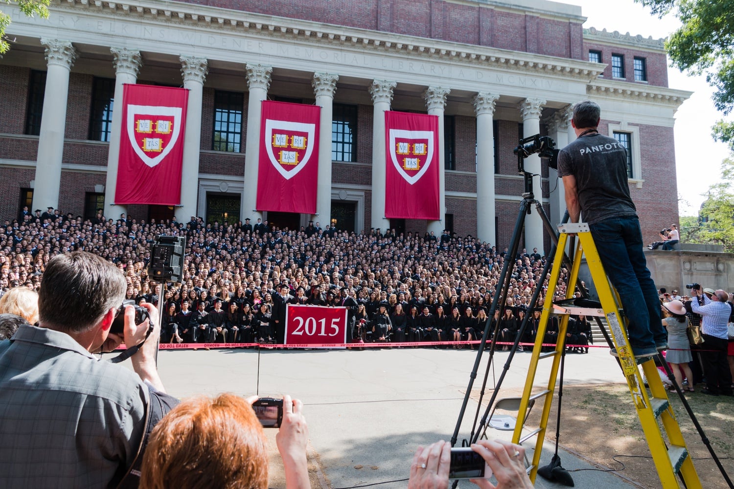 Members of the class of 2015 line up on the steps of Widener Library for their class photo. 