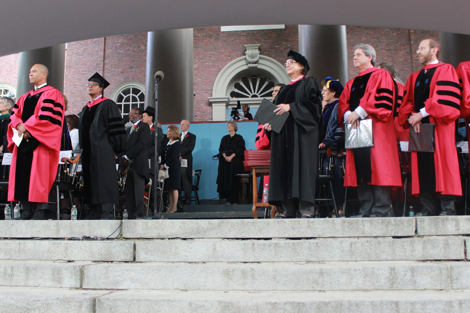 University President Drew G. Faust stands with other officials before awarding the candidates from various schools their degrees. 