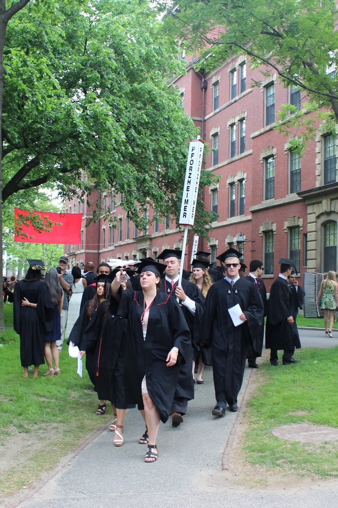 Students from Pforzheimer House process through the Yard before settling into their seats for the Morning Exercises of Commencement on May 28.