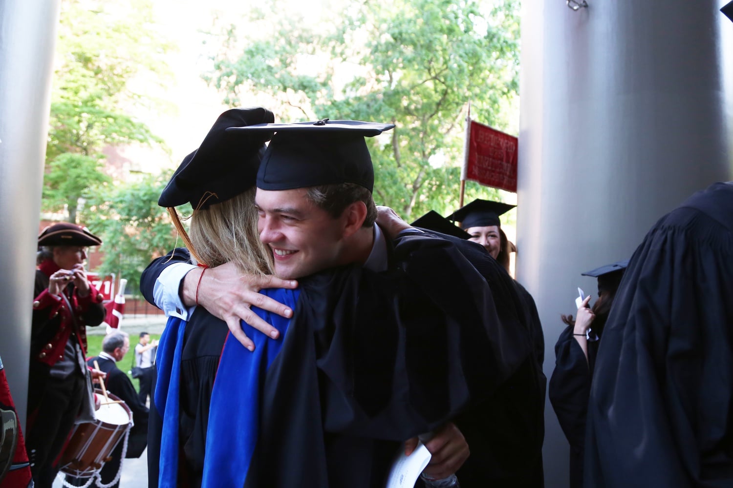 Jordan Mann '15 hugs Kirkland Co-Housemaster Verena A. Conley before entering Memorial Church preceding the Commencement Exercises on May 28.