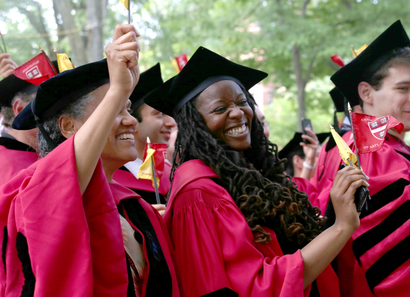 Jovonne J. Bickerstaff, who earned a PhD in Sociology, and Jacqueline C. Rivers, who earned a PhD in Sociology and African and African American Studies, celebrate during Commencement on May 28.