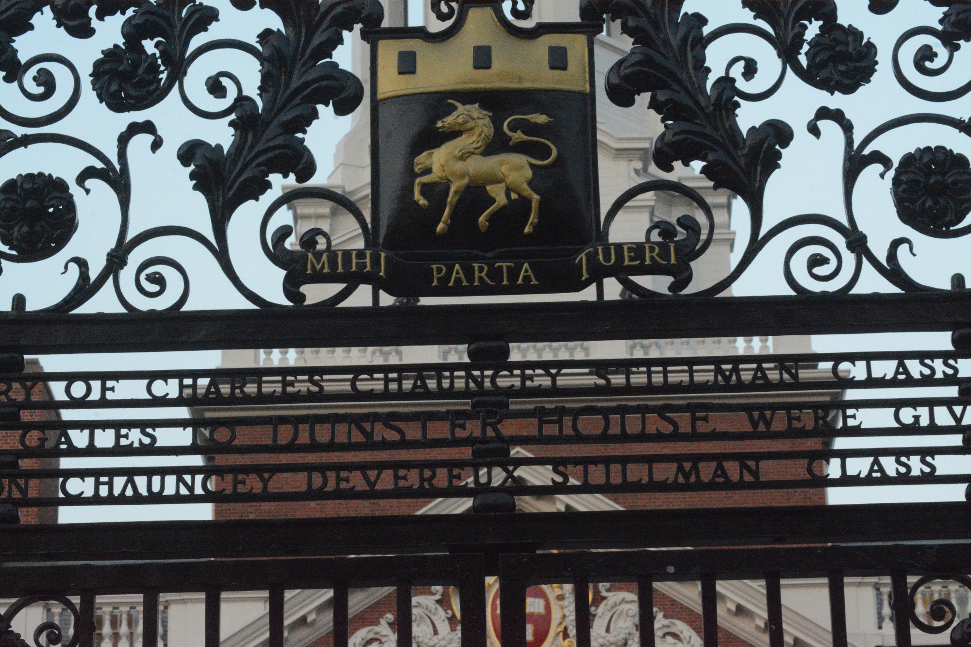 The Dunster House gate sits in front of the newly renovated house on Tuesday evening. The phrase "Mini Parta Tueri" translates to "I will fight for what is mine."