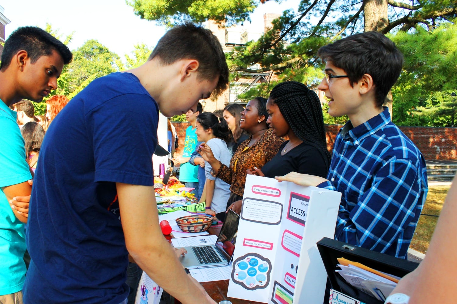 Members of Access Health, a student organization involved in providing healthcare information to low-income residents in the greater Boston area,  speak with interested students at the Activities Fair on Friday afternoon outside the SOCH.    