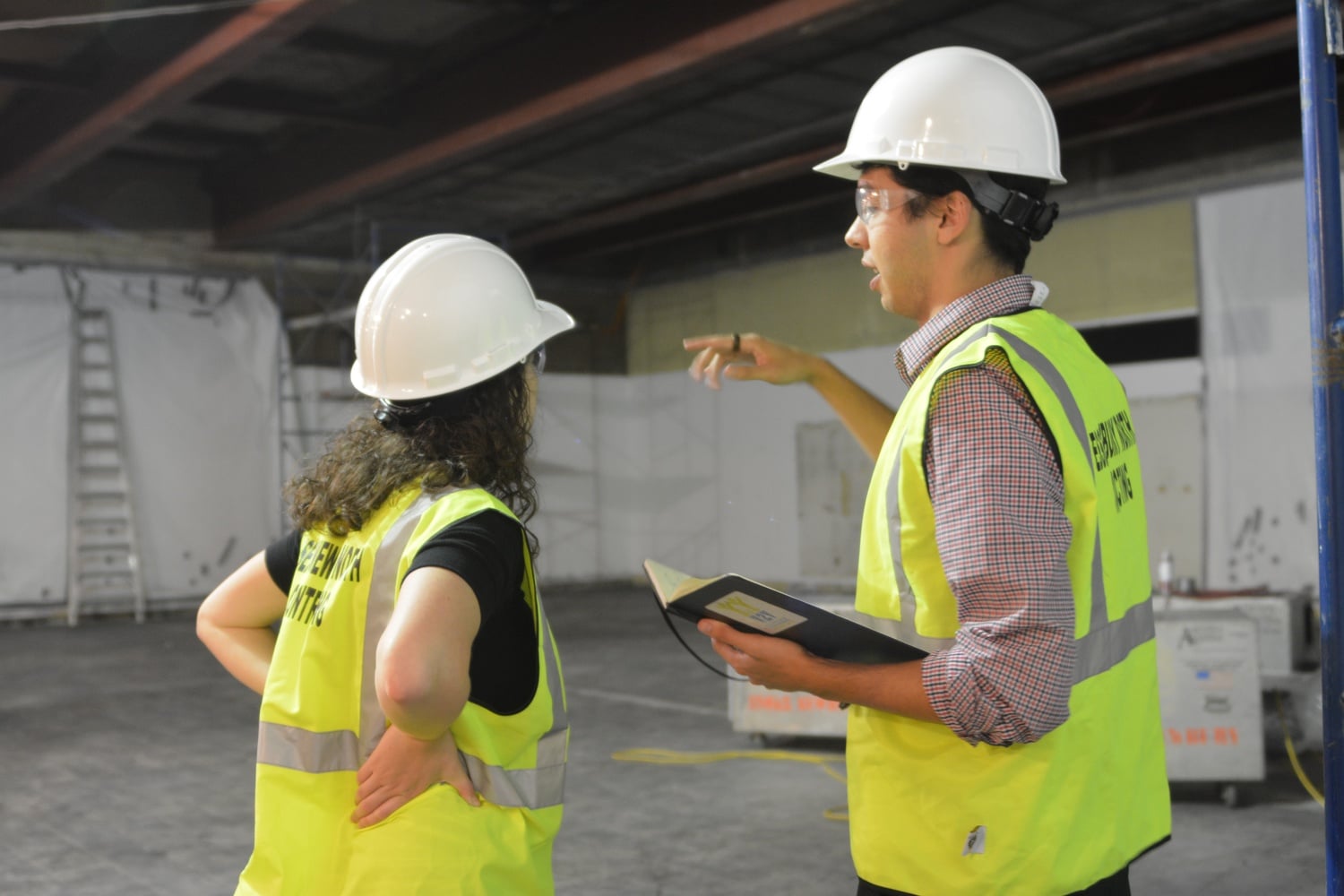 Y2Y Harvard Square co-directors Samuel G. Greenberg ’14 and Sarah A. Rosenkrantz ’14 discuss construction plans in the heart of the soon-to-be shelter. The shelter, located at First Parish Church, will include 22 beds for homeless youth.