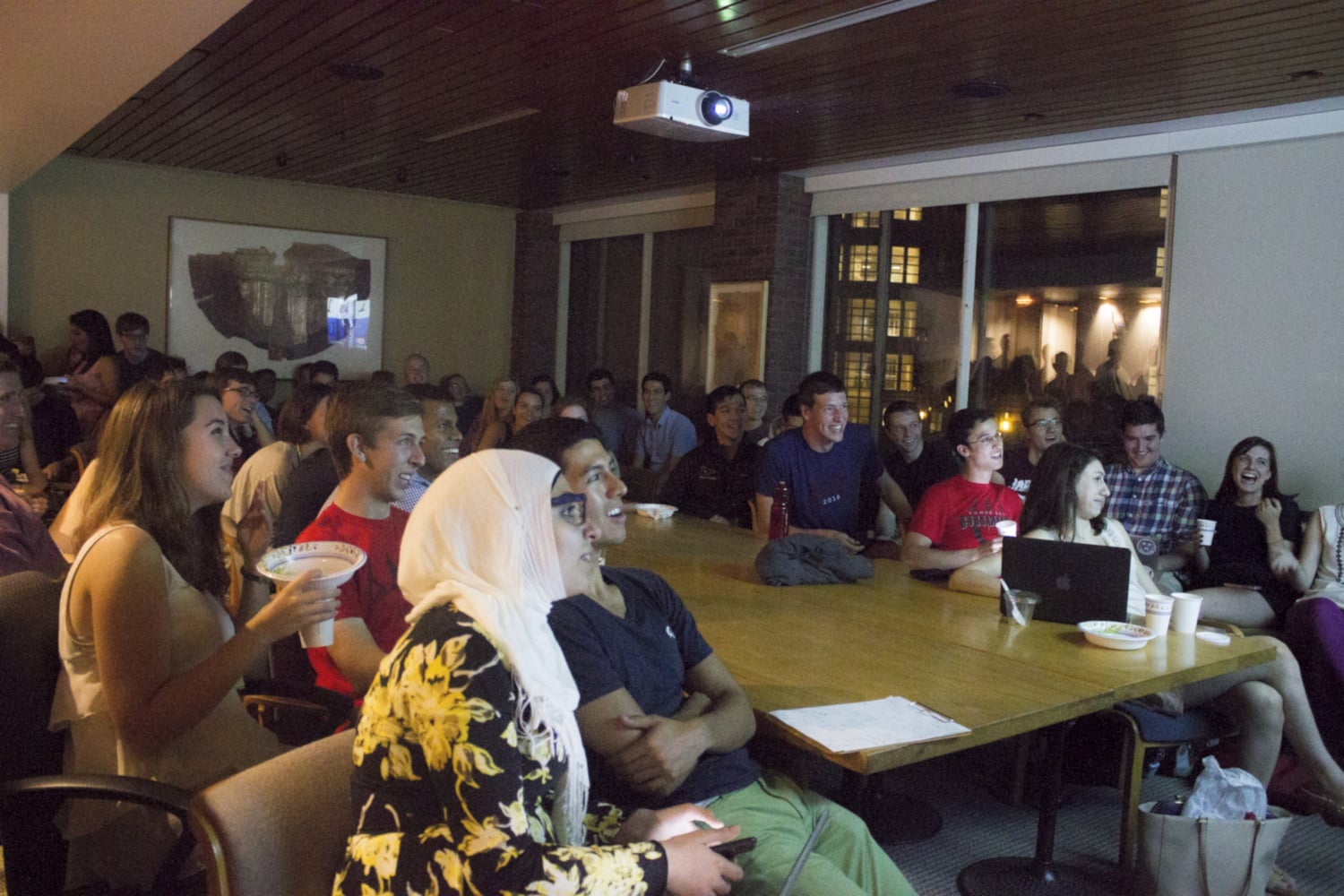 Members of the Harvard Republican Club and other students watch the Republican primary debate on CNN. The event filled three rooms at the IOP.
