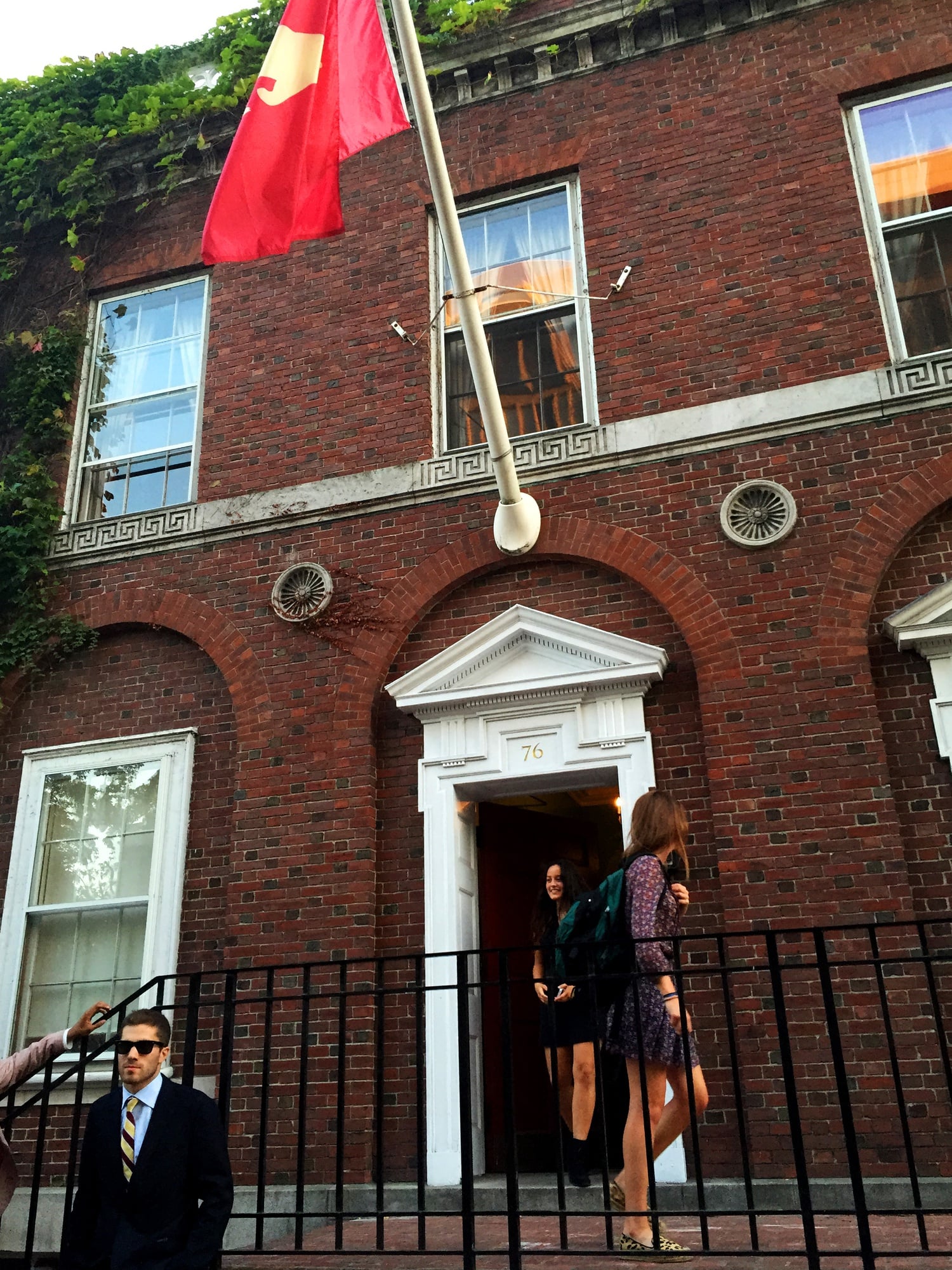 Students exit the Spee Club’s first punch event on Mount Auburn Street on Thursday evening. For the first time, the club invited women to punch this fall. 