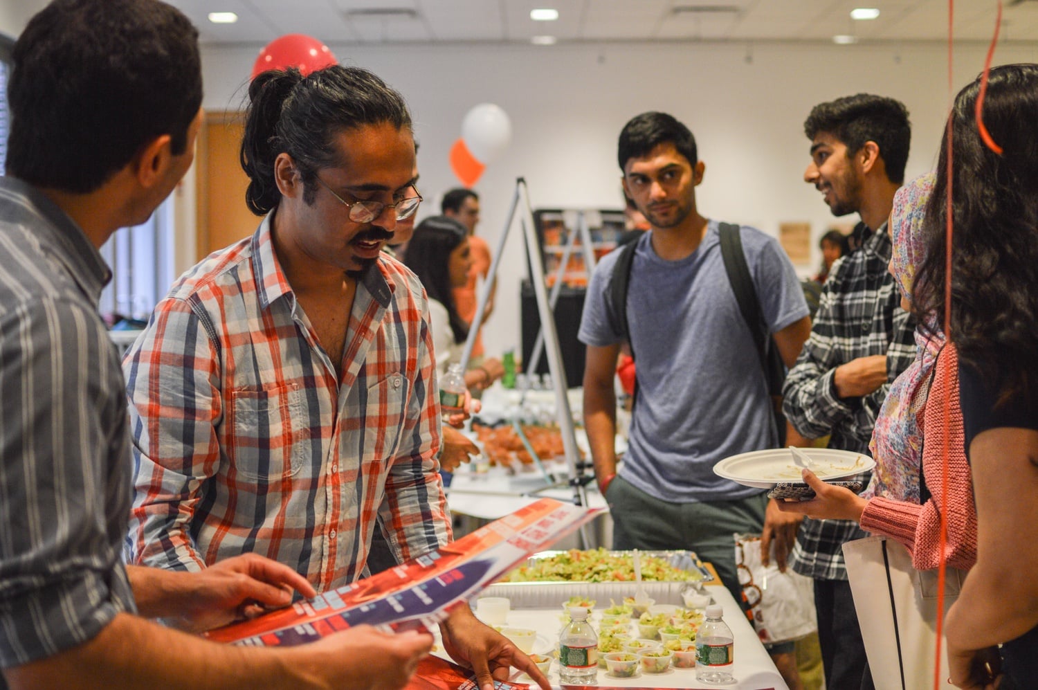 Members of student organizations, the Asia Center, and the South Asia Institute gather for the Welcome Back Chaat Party in CGIS. The event was organized to launch a dialogue between students and faculty interested in South Asia. 