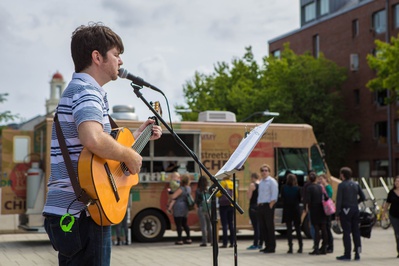 Cover image for Local Musician Performs in Science Center Plaza Concert Series