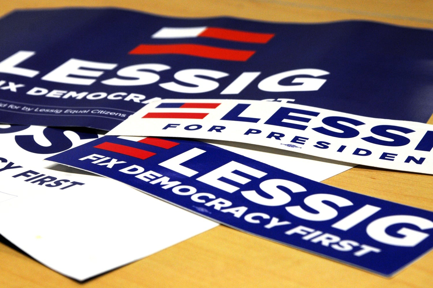 Staged memorabilia, both posters and bumper stickers, boast Larry Lessig's campaign motto: "Fix democracy first." Lessig officially declared his candidacy on Sept. 9.