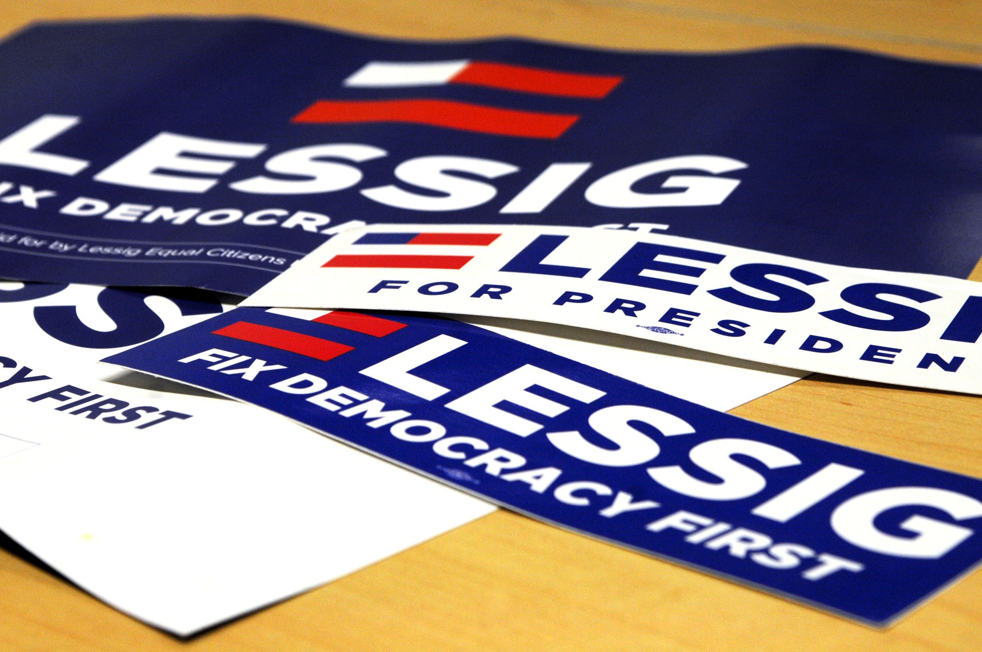Staged memorabilia, both posters and bumper stickers, boast Larry Lessig's campaign motto: "Fix democracy first." Lessig officially declared his candidacy on Sept. 9.