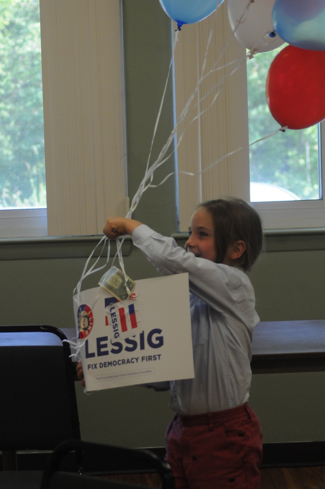 Teo, Larry Lessig's son, cheers on his father's presidential campaign after Lessig declared his candidacy in early September.