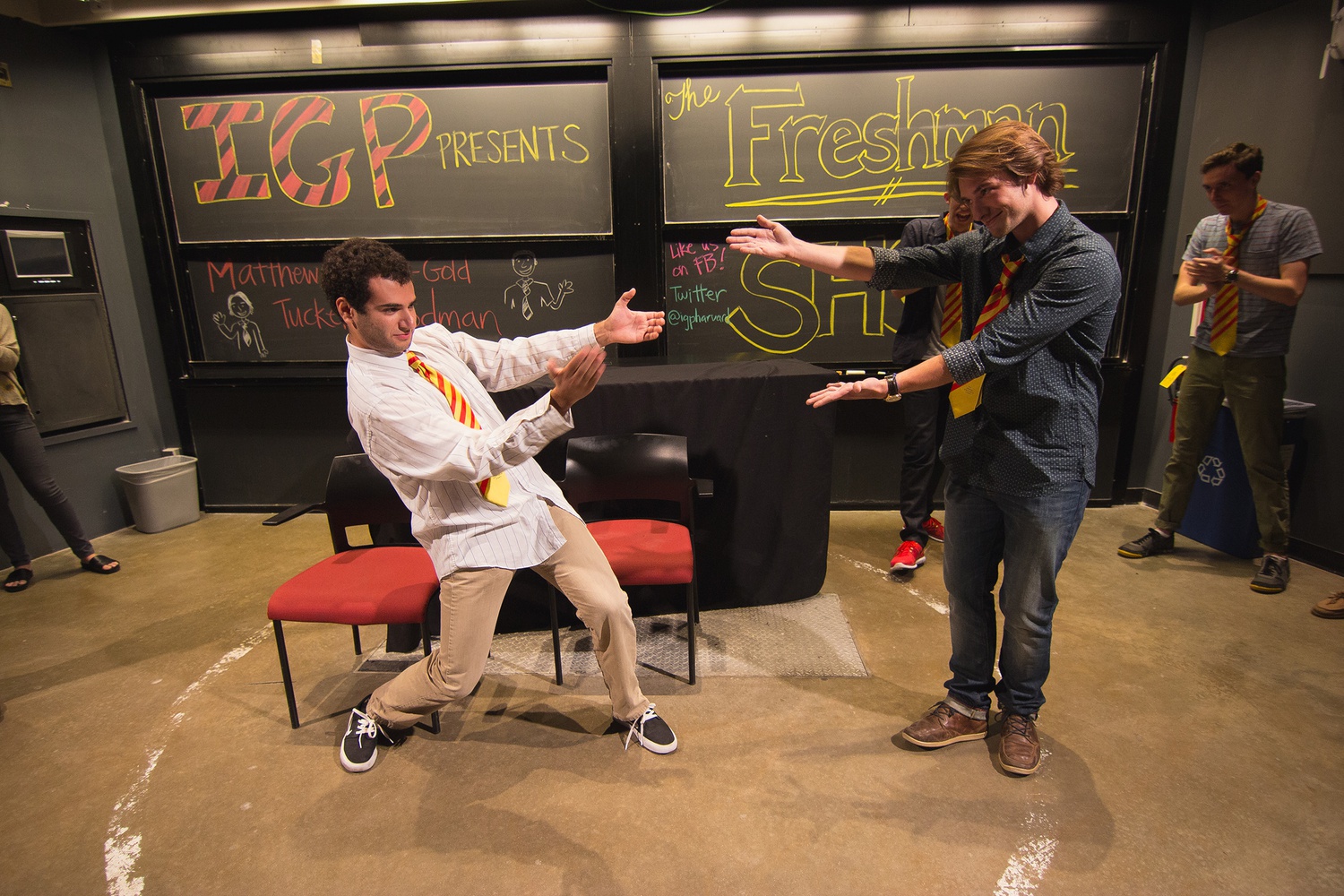 Matthew Goodkin-Gold ’19 and Tucker Flodman ’19 triumphantly receive each other after their first performance with the Immediate Gratification Players in the Science Center on Friday evening.  