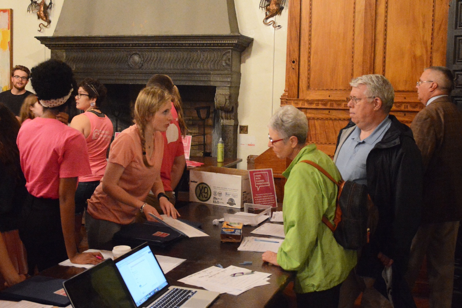 Participants check-in for Pink Out for Planned Parenthood in the Adams Junior Common Room.  The Harvard College Democrats and Planned Parenthood Advocacy Fund of Massachusetts organized the event where students donned pink and canvassed in Harvard Square in support of the organization on Tuesday, September 29, 2015.