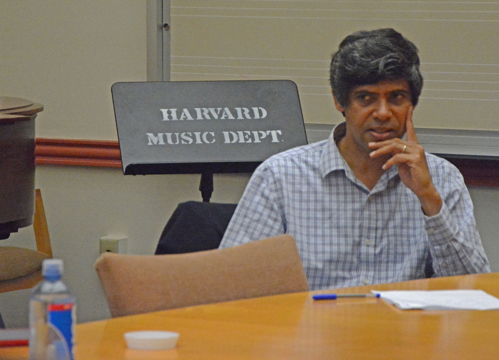 Aniruddh D. Patel, a professor at Tufts University, talks about his course on cognitive science and music with Harvard students and faculty in the music department room on a Wednesday afternoon. They discussed different ways to redesign music concentration requirements.
