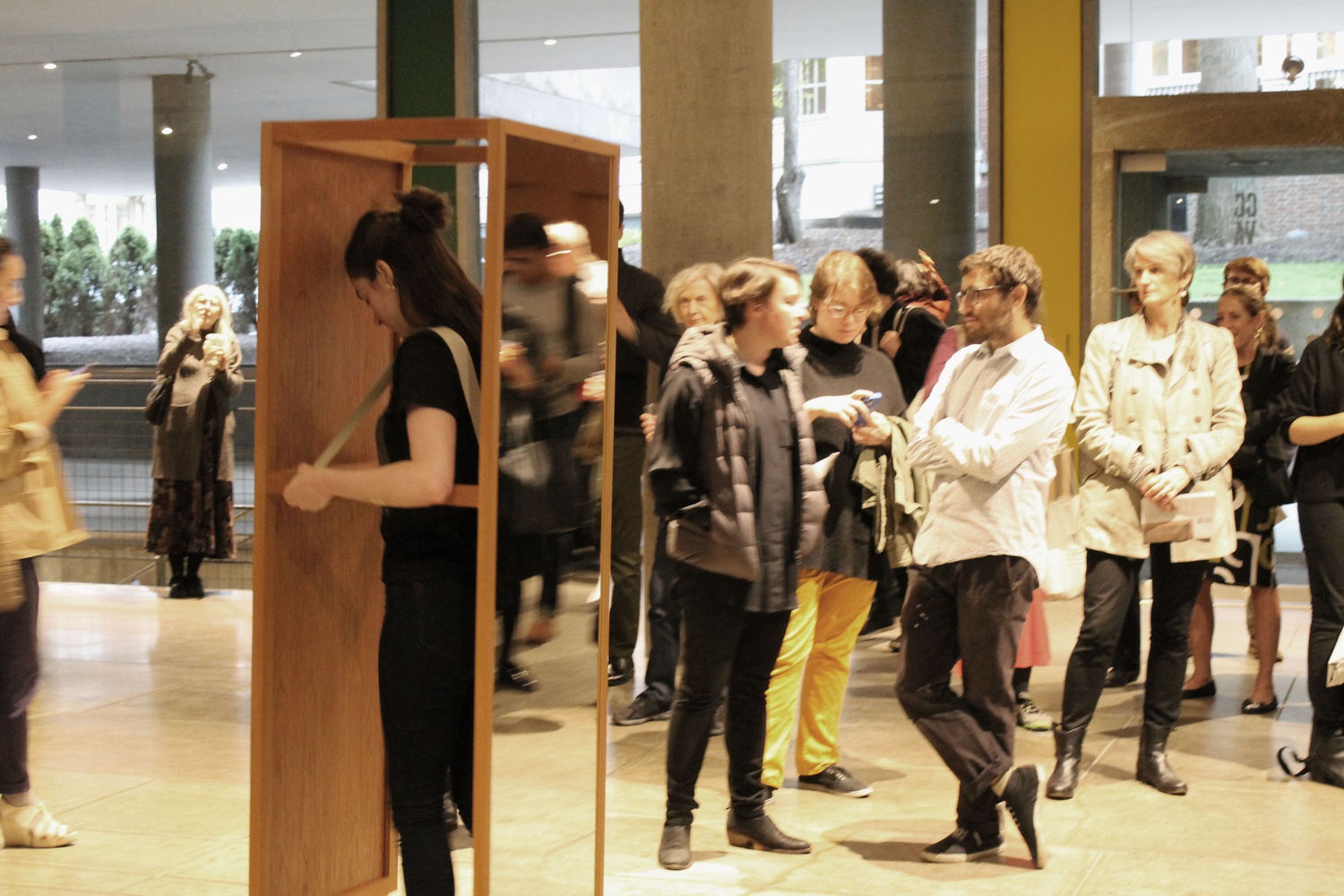 Audience members chat and watch dancer Elizabeth Leary in the new Josiah McElheny exhibit at the Carpenter Center. The exhibit, entitled “Two Walking Mirrors for the Carpenter Center” will be open to the public until October 25. 
