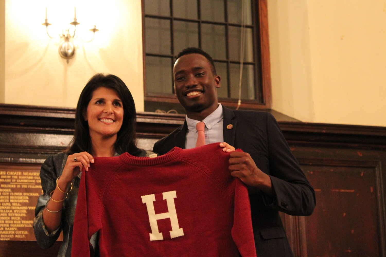 South Carolina Governor Nikki R. Haley is presented with a Harvard “letter sweater” by Harvard Foundation intern Nuha Saho ‘18 at the conclusion of the dinner event where she was invited to make remarks Thursday night. Haley spoke with pride about the idea of a “New South” that promoted racial and economic equality and defended the Republican Party from accusations of racism and intolerance. 