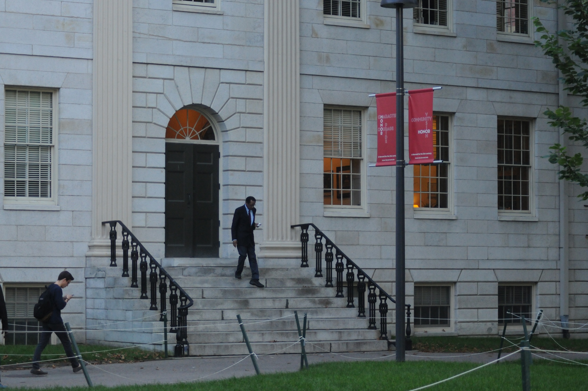 Harvard faculty exit University Hall after the first Faculty meeting of the academic year.