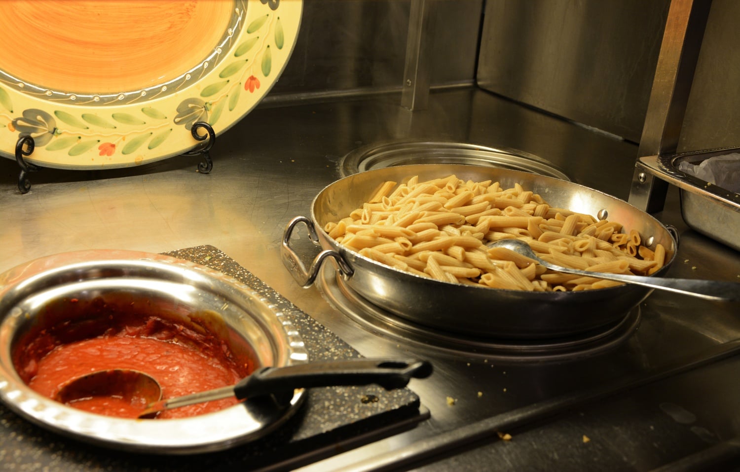Pasta is served in Eliot House’s dining hall on Wednesday evening. This semester, HUDS debuted a new pasta sauce made with locally-grown tomatoes.