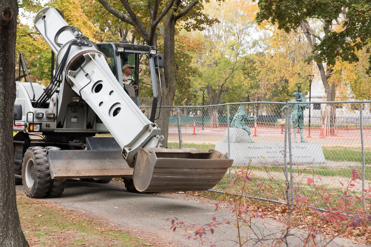 Construction workers move equipment along Garden Street.  Renovation started in June 2014, and the whole project is expected to take 18-24 months.