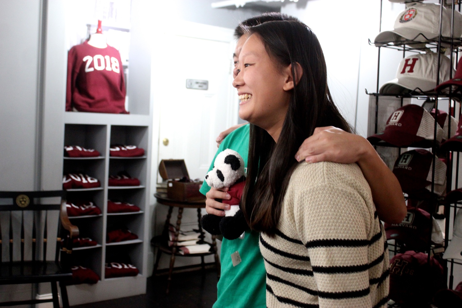 Jessica Li ’17 poses for a picture at the H sweater release party in the Harvard Shop.
