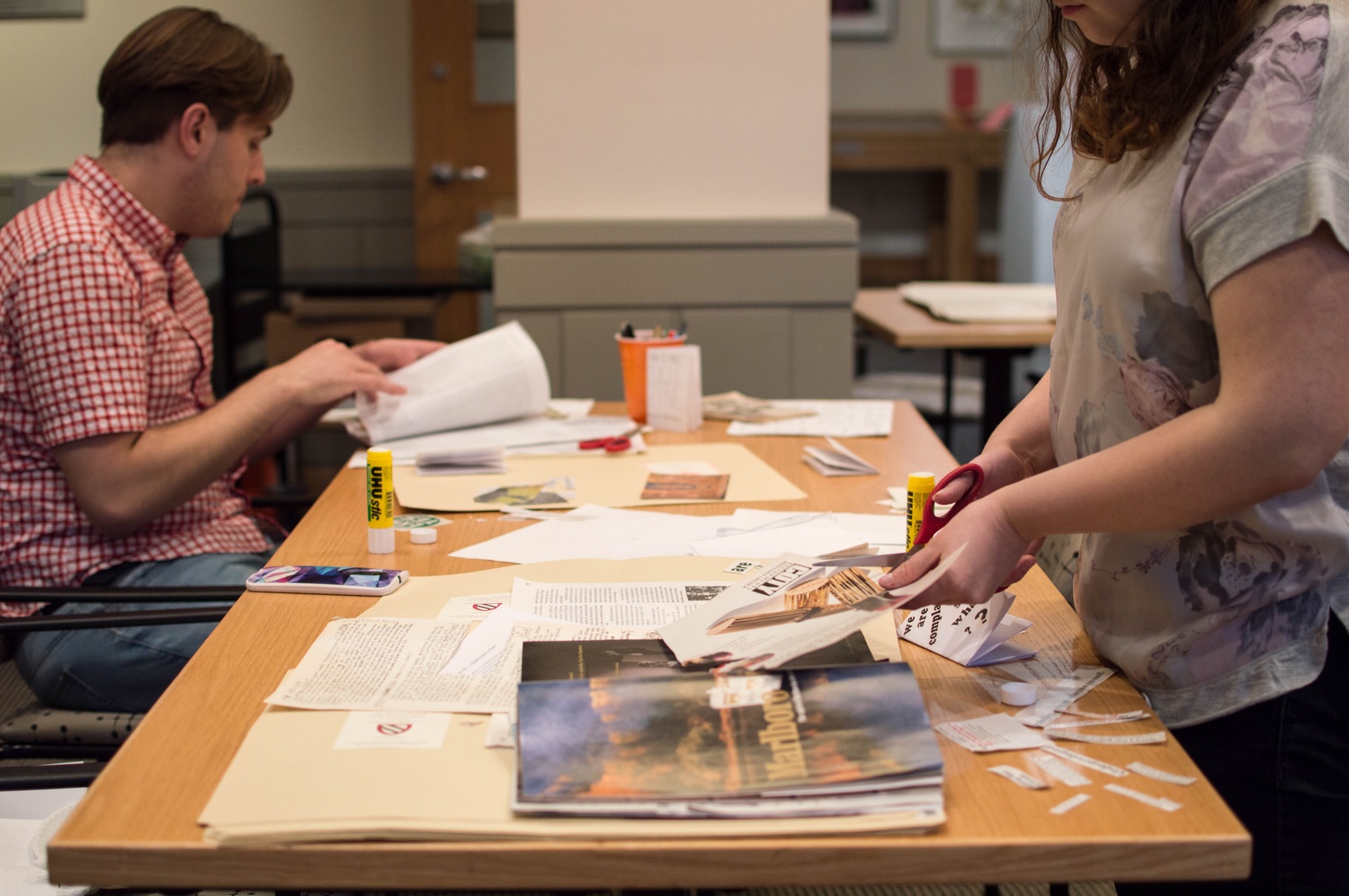 Students participate in a “zine-making” event at the Schlesinger Library, which gave students the opportunity to make the small, informal booklets dubbed “zines."
