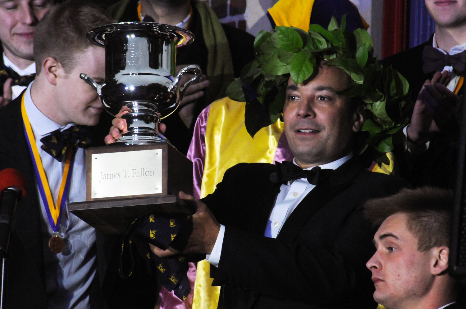 Jimmy Fallon, named the Harvard Lampoon's "Emperor of Comedy," raises his trophy on Saturday afternoon.