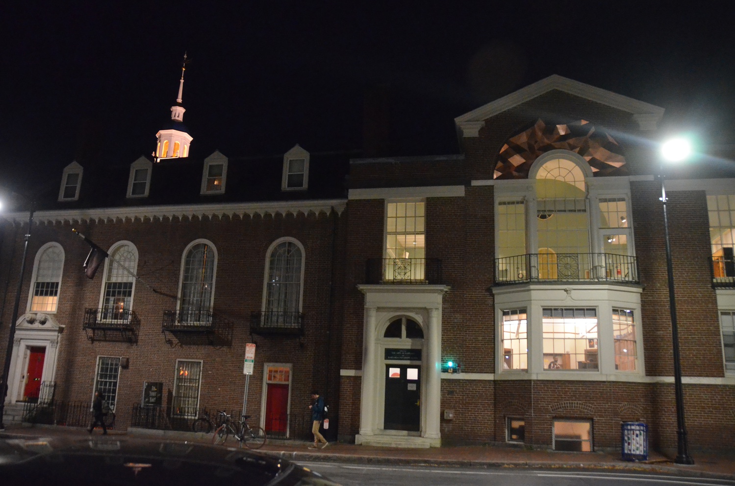 Passersby walk past the Office for the Arts on Monday evening. The Office for the Arts aims to engage students in the arts through various events and programs.