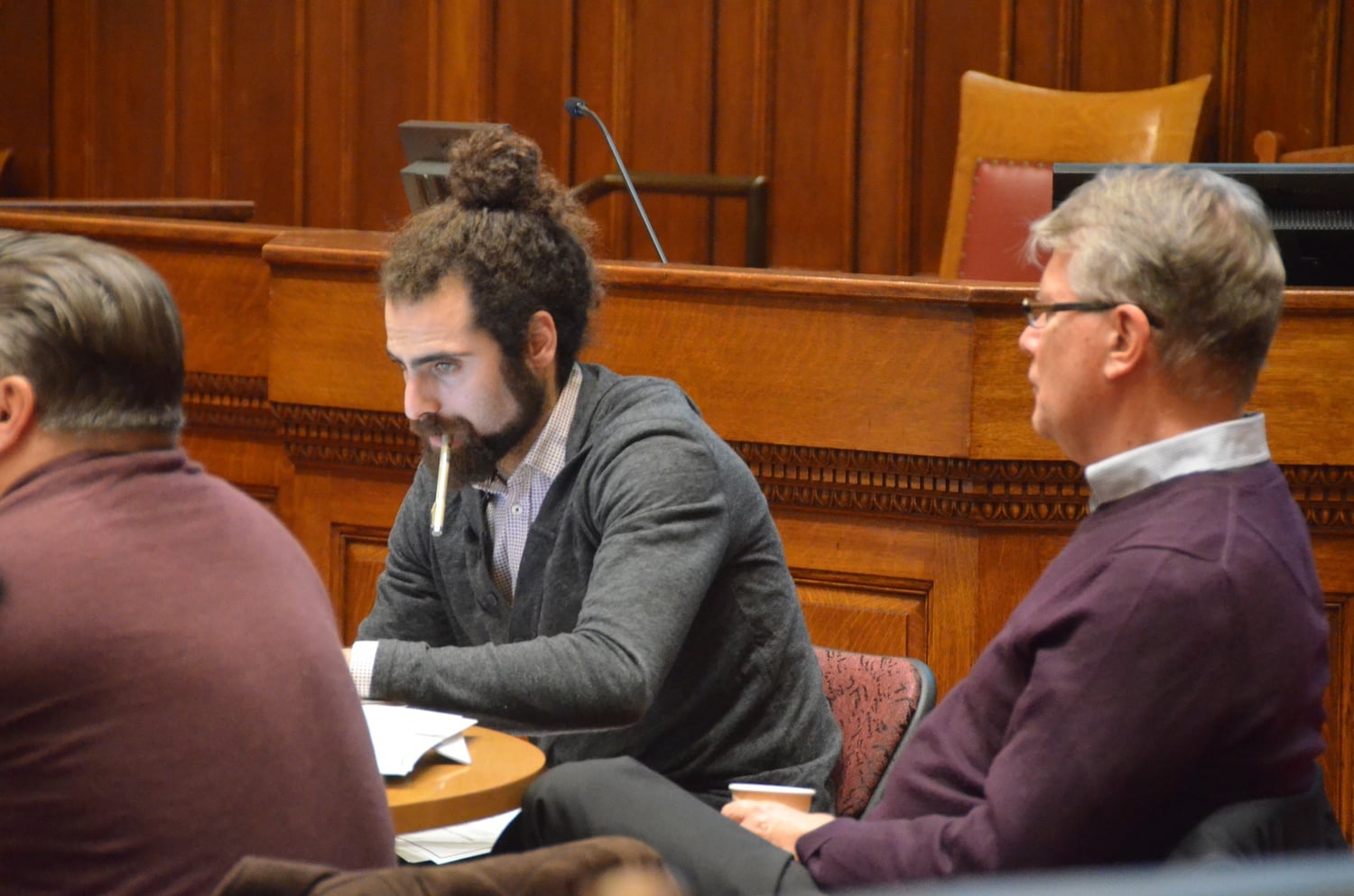 Former Cambridge City Councillor Nadeem A. Mazen sits at a City Council meeting. Mazen was arrested in April, years after he left office, and faces charges of kidnapping, witness intimidation, destruction of property, and assault and battery.
