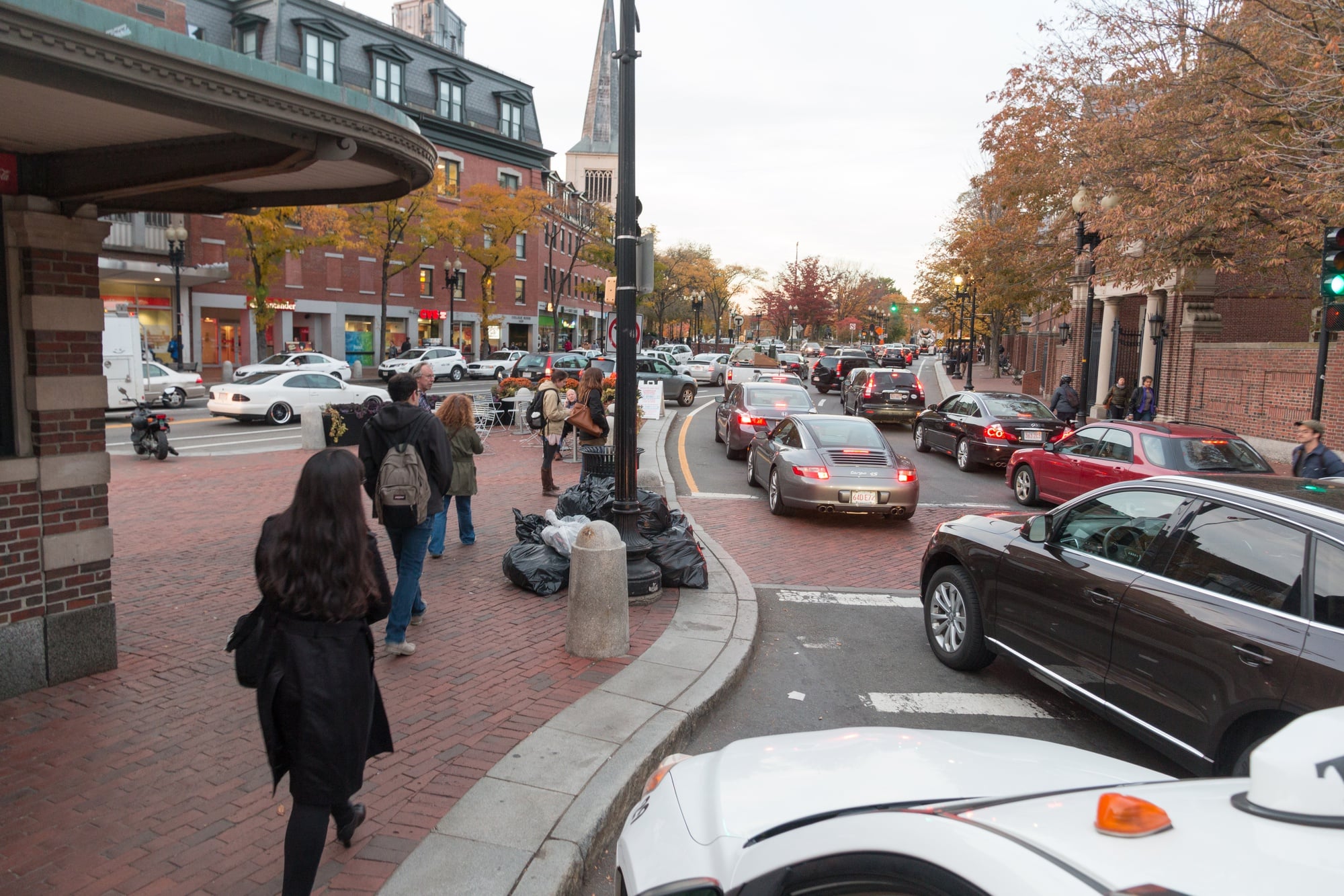Traffic moves in Harvard Square.