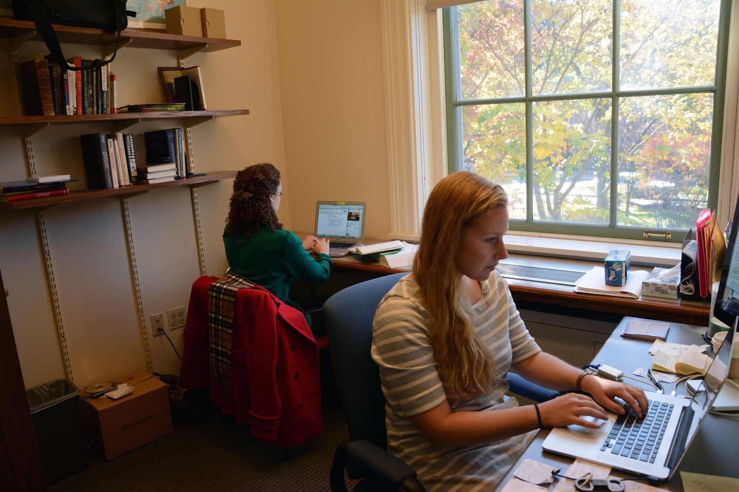 Leah Reis-Dennis ’13 and Caitlin M. Ballotta ’14 work in the "Poetry in America" office at the Barker Center. Their day-to-day work ranges from close reading poems to coordinating legal agreements with artists’ estates.