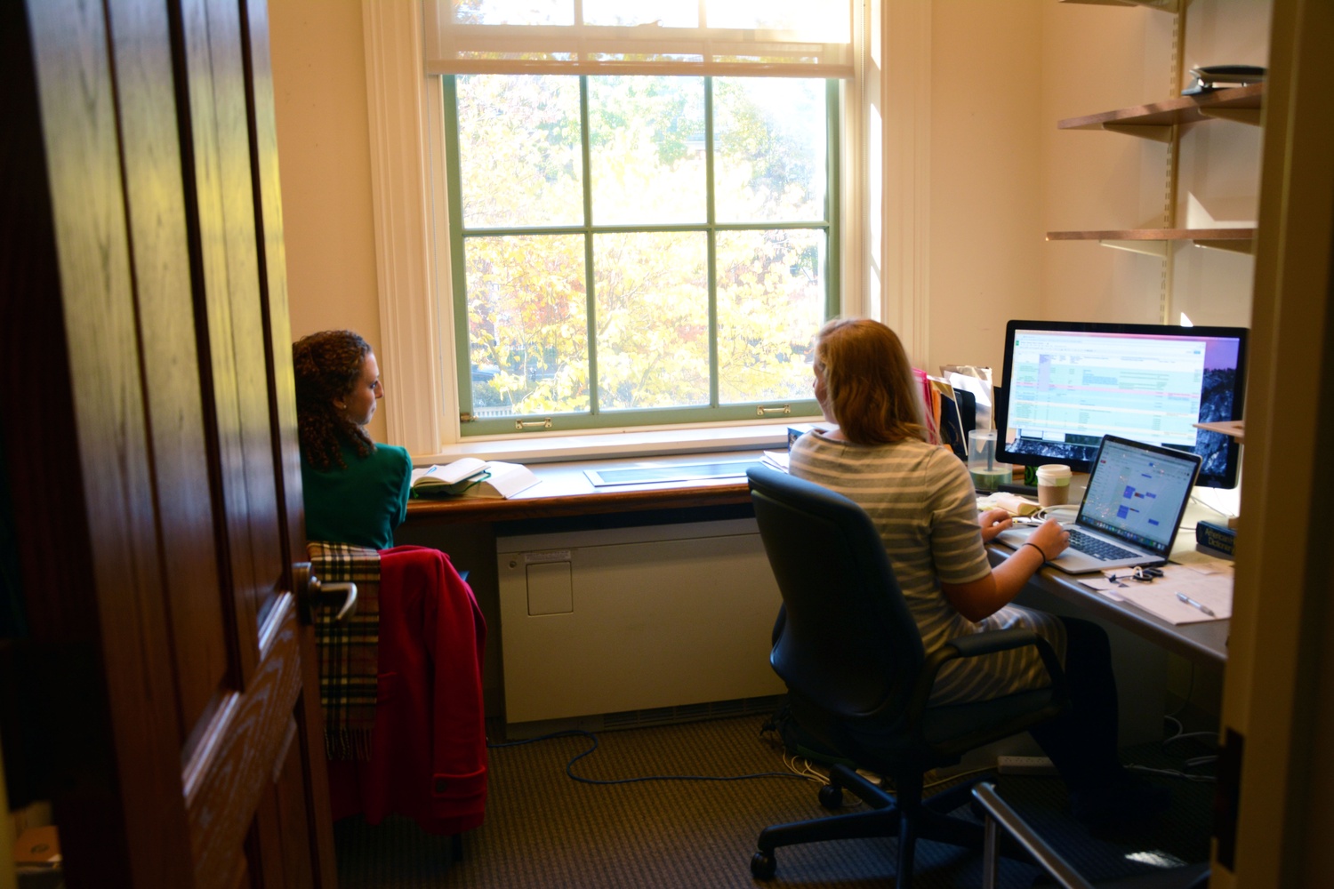 Leah Reis-Dennis ’13 and Caitlin M. Ballotta ’14 work in the "Poetry in America" course offices. “It’d be a little idealistic for me to say that you can find your dream job right off the bat,” Reis-Dennis acknowledges. “I like to joke I’m the only person who studied poetry in college who’s now making a living working in poetry.”