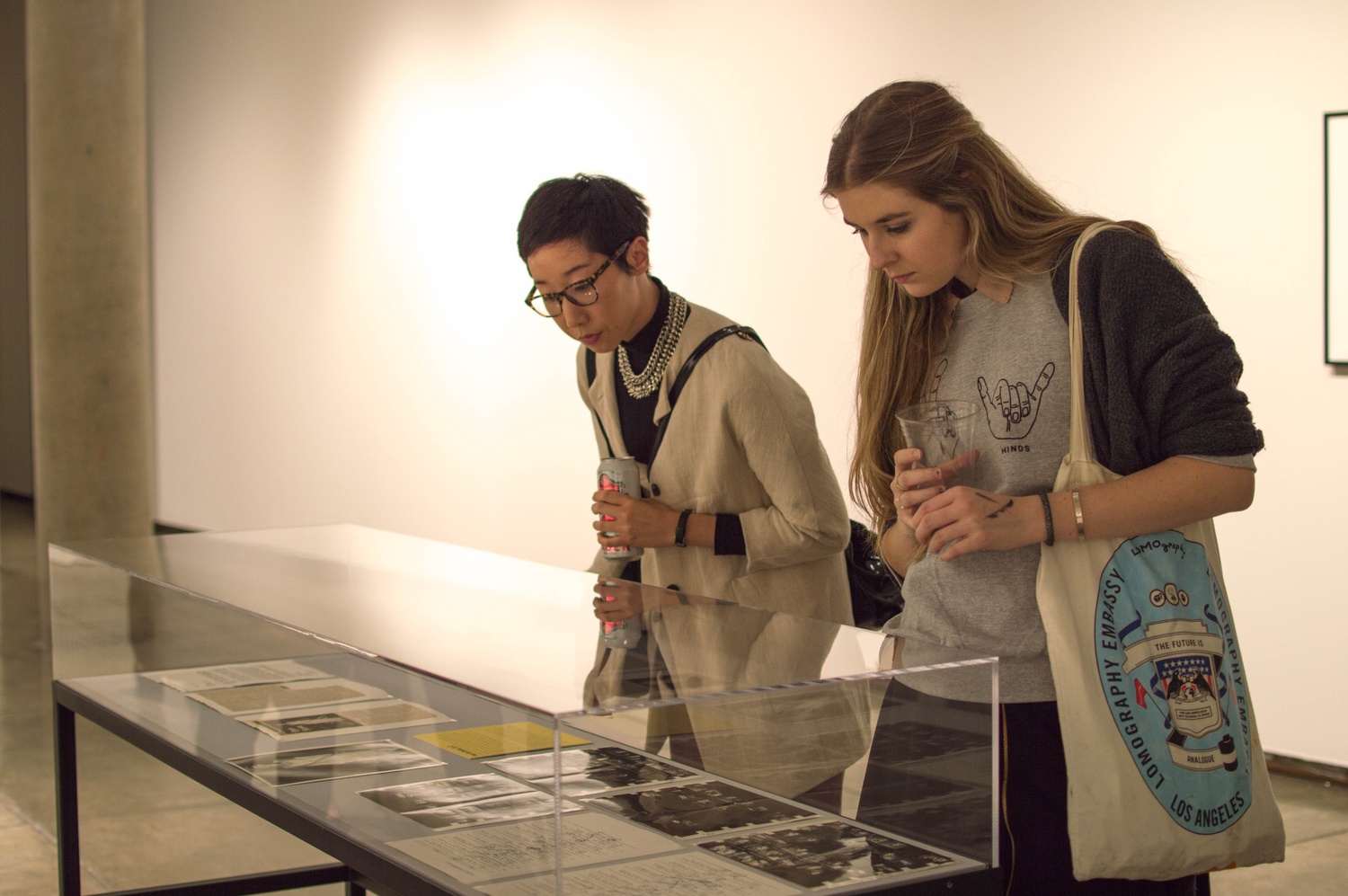 “It feels like you’re going to two shows,” said Harvard Art Museums Curatorial Assistant Jessica S. Hong about the simultaneous opening of two new exhibits on Thursday evening. Hong, left, and Madi L. Stine ’17 examine art during a new show in the third floor of the Carpenter Center.