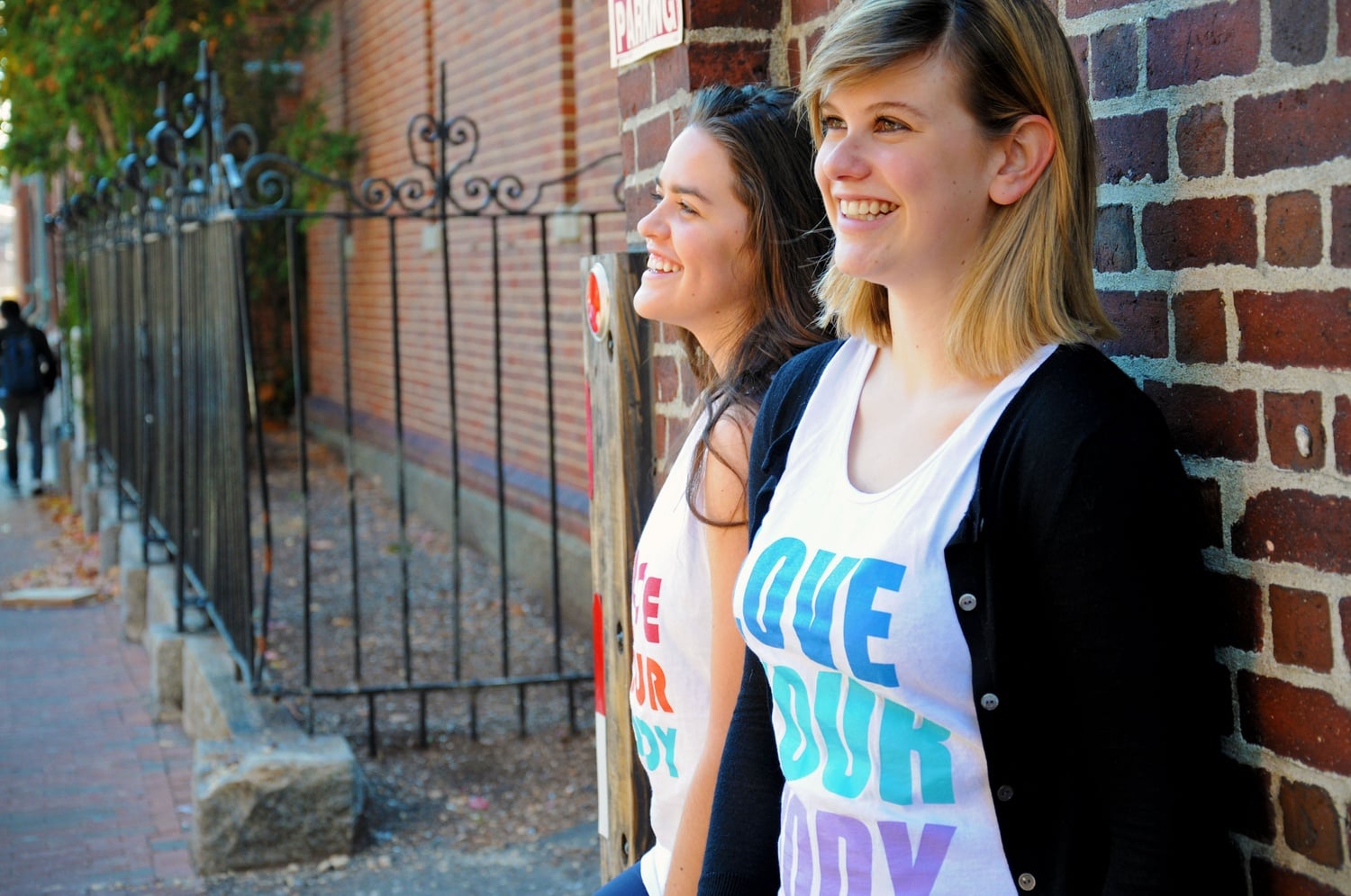 Karen M. Maldonado ’18 and Cassandra Hastie '18, both ECHO peer counselors, wear "Love Your Body" bro tanks that ECHO sold last semester. 