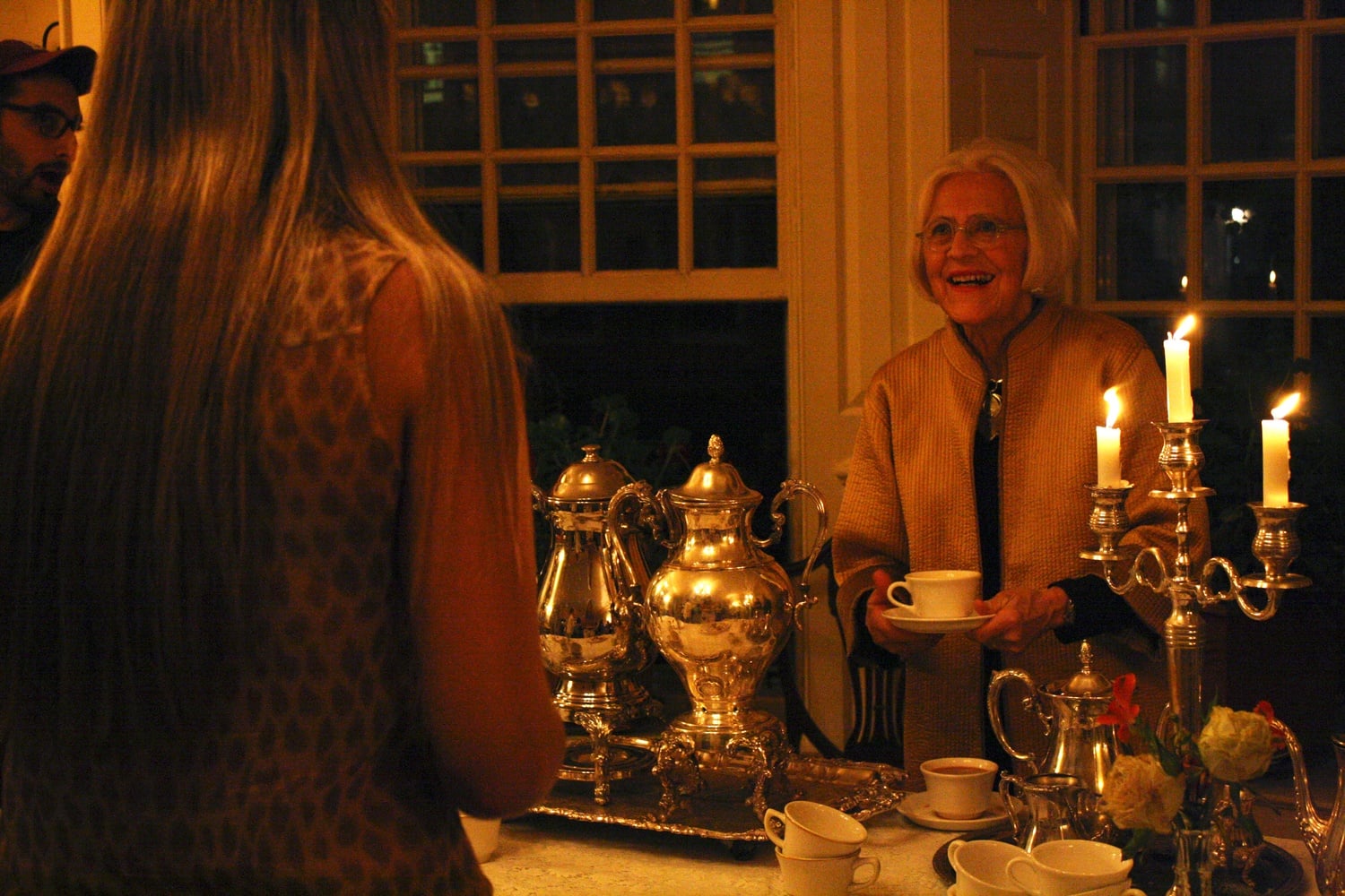 Dorothy A. Austin, one of the Lowell House masters, serves tea to students at Lowell Tea, a weekly event hosted by the two House masters. Students later sang in celebration of Austin’s birthday on Thursday evening.