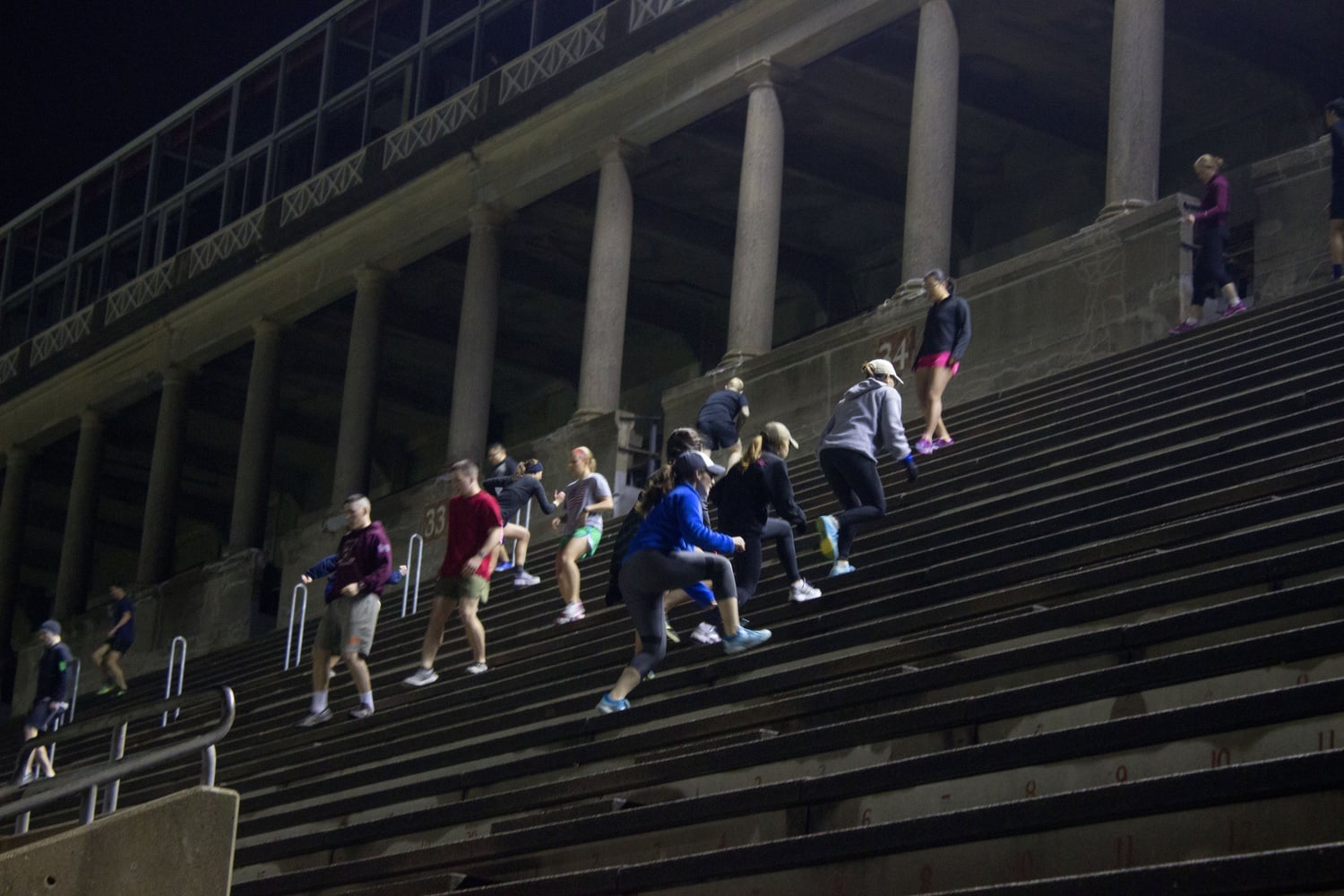 Veterans, students in ROTC, and supportive community members begin running up the steps of Harvard Stadium. They gathered on Veteran’s Day to support past and present veterans and raise money for the Warrior Scholar Project.