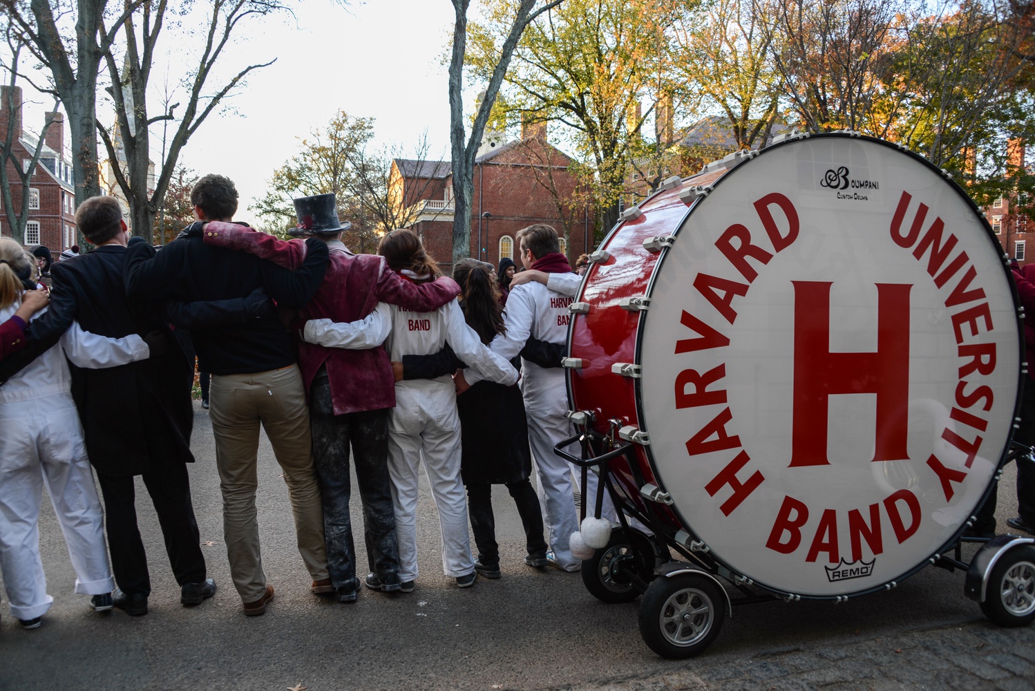 The Harvard Band performs in front of the John Harvard statue during their march through the yard.