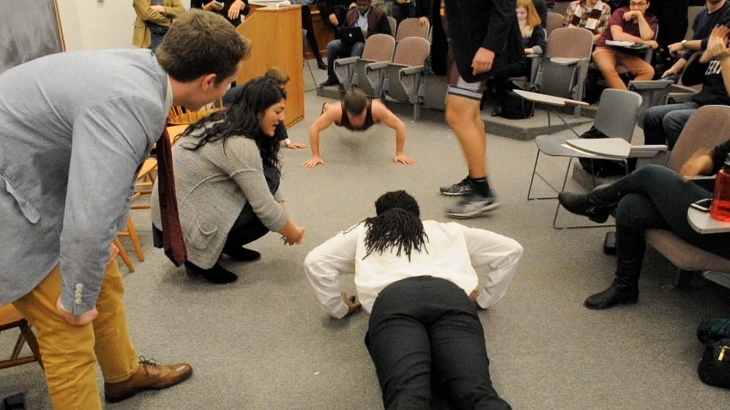 Undergraduate Council hopefuls William A. Greenlaw '17 and Jeffrey M. Ott ’16-’17 face off in an impromptu push-up contest at Saturday’s Crimson-hosted debate. Ott won, 80-49.