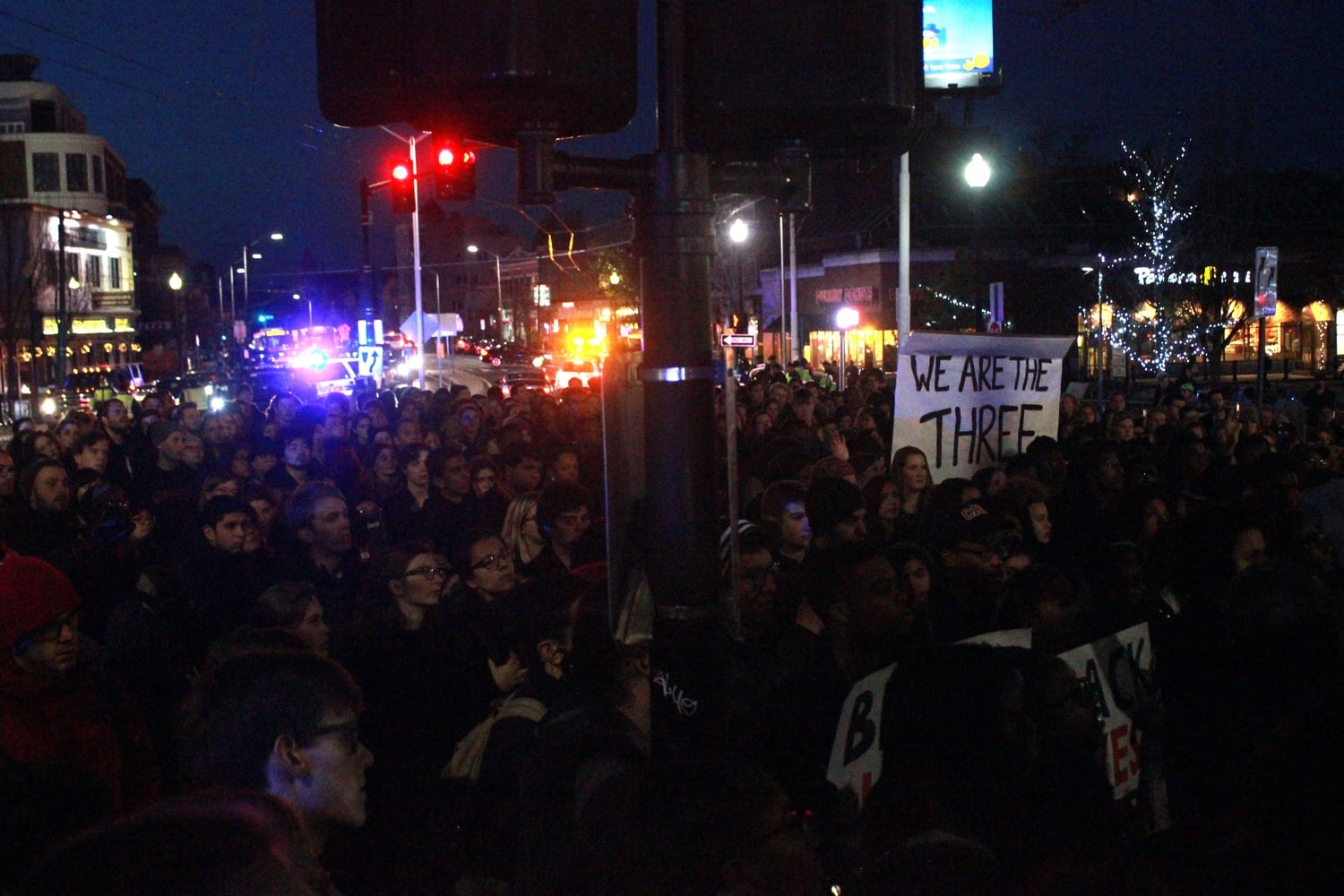 Students from Harvard and Tufts listen to student leaders from both schools after marching to Porter Square. The event was part of a larger National Student Call to Action, encouraging colleges across the country to organize their own events to bring attention to the continuing problem of racial inequality on college campuses.
